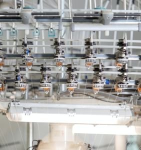 Here is the image of the shuttle loom machines which are used for Yarn weaving and making clothes. These machines are designed by the best Power looms machine manufacturer in Surat Paramount Looms.